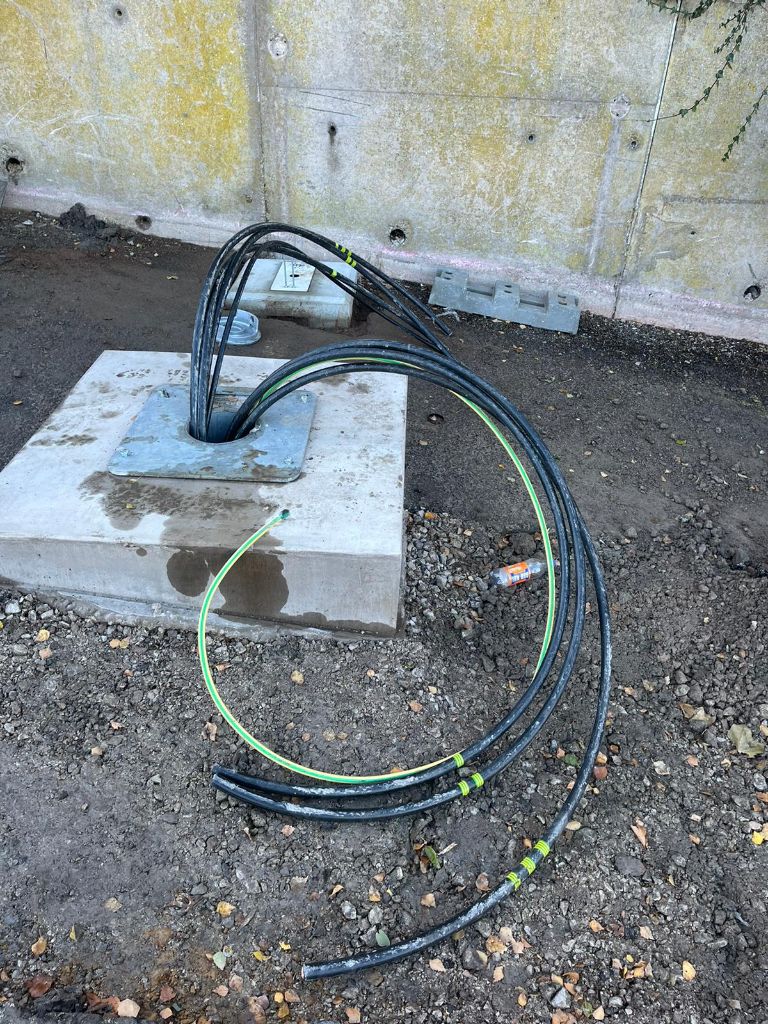 Cables emerging from a concrete pit entry point into the substation base — Coseley